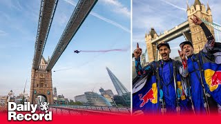 Skydivers achieve Tower Bridge ‘dream’ by completing wingsuit flight through London landmark [upl. by Stephanus]