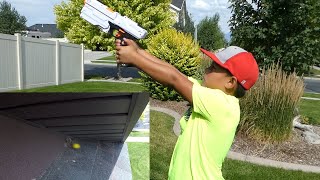 SHOOTING A WASP NEST WITH A NERF GUN [upl. by Rakso]