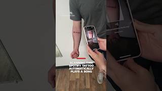 Scanning this Spotify tattoo automatically plays a song [upl. by Piers350]