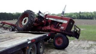 Farmall 656 Gooseneck trailer unloading accident [upl. by Dlaner]