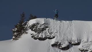 Snowboarder Spins Off Cliff And Slides Downhill  13637665 [upl. by Arramat810]