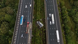 Shocking footage shows aftermath of lorry that plummeted off motorway bridge  SWNS [upl. by Ashbaugh266]