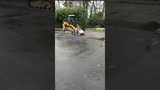 A skid steer expertly planing the road to a precise depth of 30 mm [upl. by Arihppas]