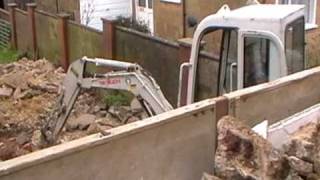 Takeuchi TB016 Loading Lorry with Rubble [upl. by Anatnom439]