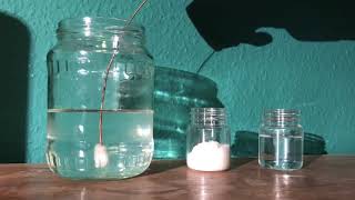 Nucleation point being introduced to a supersaturated solution of sodium acetate in water [upl. by Romonda]