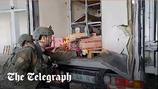 Israeli soldiers filmed setting fire to scarce water and food supplies [upl. by Elodie]