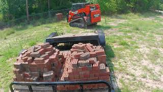 Moving bricks and forestry mulching underbrush [upl. by Ellehcyar]