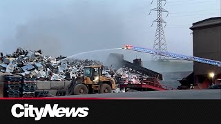 Crews battle fire at metal recycling facility in SE Calgary [upl. by Janaya]