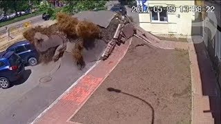 Underground water pipe explosion destroys road in Ukraine [upl. by Eniamart]