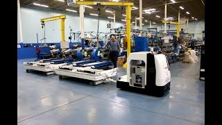 Dematic Compact Tugger AGVs at AER Manufacturing [upl. by Celene]