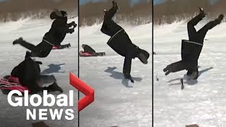 Reporter flipped by sled during news report OFFICIAL VIDEO [upl. by Yromem777]