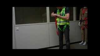 How to put on fall arrest harness vest with shock absorber [upl. by Nahtanha]