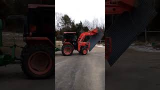 Husband uses his tractor to fix a roof of a small shed [upl. by Nuajed678]