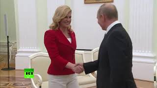 Russia Croatian president gives Putin personalised national team jersey [upl. by Ardnoid]