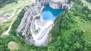 UAVDrone Views of Atlantas Bellwood Quarry City Skyline in Background [upl. by Arly]