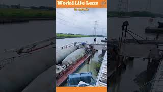 A barge with mixing tanks transports concrete to remote construction sites via water [upl. by Rodina620]