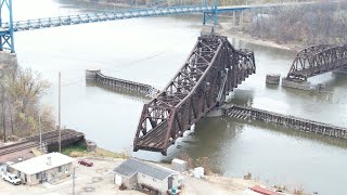 RAILROAD SWING BRIDGE ACTION LONG CPKC MANIFEST AND UNION PACIFIC DOUBLE COAL DRONE VIEWS [upl. by Amrac58]