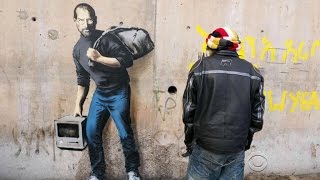 Street artist Banksy puts new face on refugee crisis [upl. by Donovan]