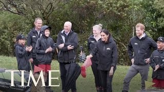 Whats Welly Wanging Meghan Markle Beat Prince Harry At This Cool Boot Throwing Game  TIME [upl. by Clarhe]