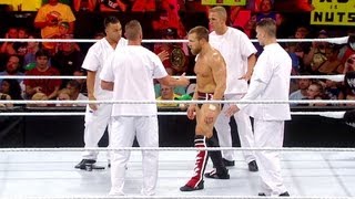 A furious Daniel Bryan is escorted out of the building Raw July 30 2012 [upl. by Gagliano554]