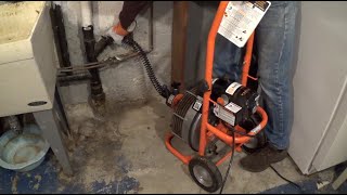 How to Unclog a Sewer Line with a Rented Drain Cleaner [upl. by Sprung]