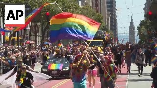 Parades in New York and San Francisco celebrate LGBTQ Pride month [upl. by Htnicayh]