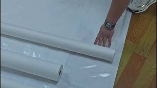 Wholesale based painters apply felt backing adhesive between subfloor [upl. by Ardnod]