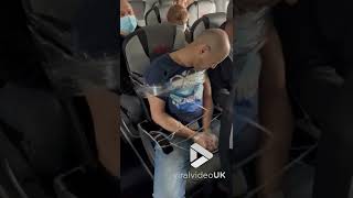 Drunk passenger gets strapped in seat after smashing plane window  Viral Video UK [upl. by Aohsoj54]