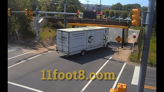 Moving truck hits 11foot88 bridge and leaves presents for bystanders [upl. by Meingolda]