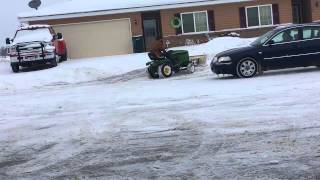 John Deere 325 Plowing 4 Inches Of Snow Without Tire Chains On [upl. by Giuseppe]