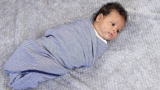 How to Swaddle a Baby Using a Blanket [upl. by Fionnula977]