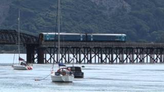 Barmouth Wales Arriva train DMU crosses River Mawddach Bridge 31 July 2015 [upl. by Elimay58]