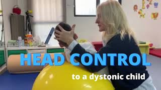 Facilitating head control to a dystonic quadriplegic child with cerebral palsy NDT intervention [upl. by Eitsirc]