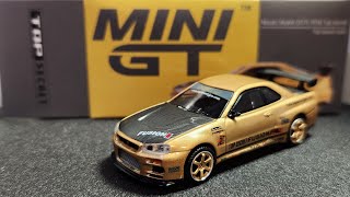 MINI GT 164 Nissan Skyline GTR R34 Top Secret Top Secret Gold MGT00676 [upl. by Claudio]