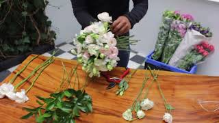 Craft a stunning bridal bouquet with lisianthus ranunculus alstroemerias and ruscus Watch now [upl. by Jareen]