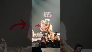 Justin Bieber brings a young fan on stage while hes singing [upl. by Anaerda]