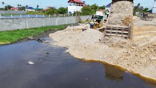 Just New Land Filling Deep Pond Use Dump Truck Unloading Stone and Bulldozer Push Stone in Water [upl. by Tsiuqram]