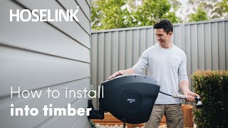 How to install a Hoselink Retractable Hose Reel into timber [upl. by Yevette443]