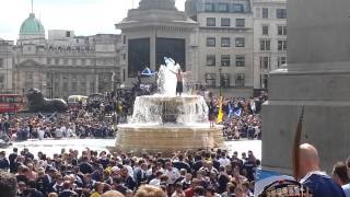 Scottish fans on the fountain in Trafalgar Square [upl. by Nihi]