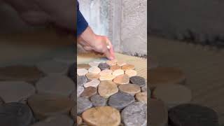 Installing a pebble shower floor diy tiling howto tile construction riverrock pebbles [upl. by Lebanna]