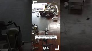 SURVEILLANCE FOOTAGE Wild video shows SUV crashing through Dallas gyms wall striking two people [upl. by Lupien]