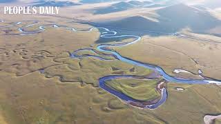 The Mergel Gol River meanders through the enchanting landscape of Hulun Buir Grassland in N China [upl. by Delfine]