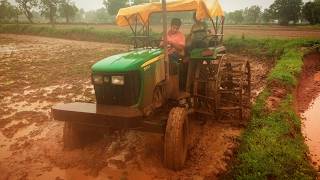 John Deere 5055e  puddling with double cage wheel  5310 [upl. by Anirac]