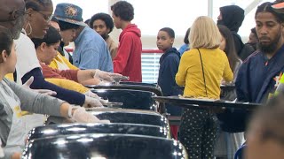 Super Feast volunteers serve Thanksgiving meals clothing and toys to hundreds of Houstonians [upl. by Birk722]