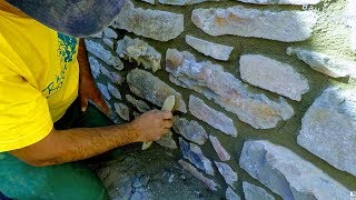 HOW TO BUILD NATURAL STONE WALL RETAINING ROCK BOULDERS DETAIL MASONRY ADVICE TUTORIAL CONSTRUCTION [upl. by Amabel294]