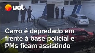 PMs são presos após serem flagrados em vídeo assistindo a carro ser depredado na Cidade de Deus RJ [upl. by Crisey]