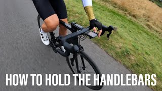 How to hold the road bike handlebars for power and stability [upl. by Aimas580]