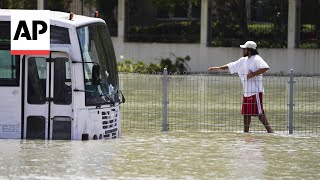 Storm dumps record rain across UAE floods Dubais airport  AP Explains [upl. by Anier]