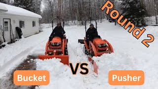 BX 2380 Plowing snow with a bucket and a snow pusher Round 2 Which is better [upl. by Lundquist]