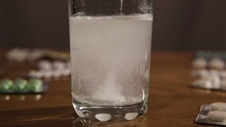 Effervescent Tablet Falling In Water Stock Footage [upl. by Hasile]